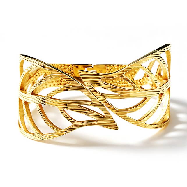 Bracelet rigide à ressort avec feuilles perforées